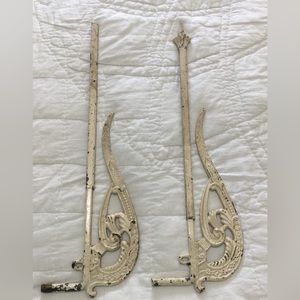 Two antique cream color metal swing arm curtain/drapery rods